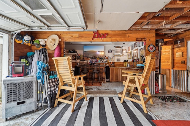 garage featuring wooden walls