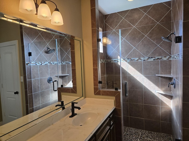 bathroom featuring vanity and an enclosed shower