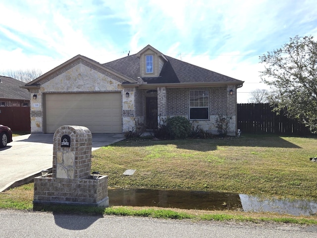 view of front of home featuring a garage and a front lawn