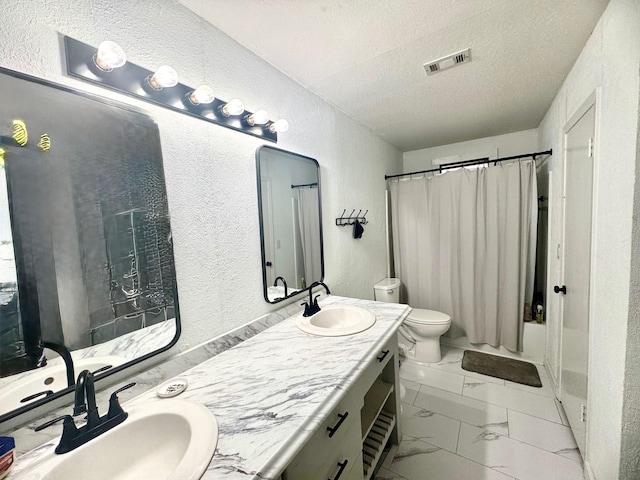 full bathroom with vanity, shower / bath combo, toilet, and a textured ceiling