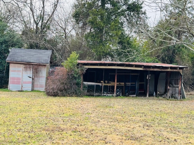 view of outbuilding featuring a yard