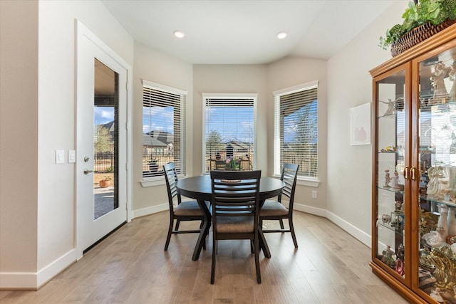 dining space with light hardwood / wood-style floors