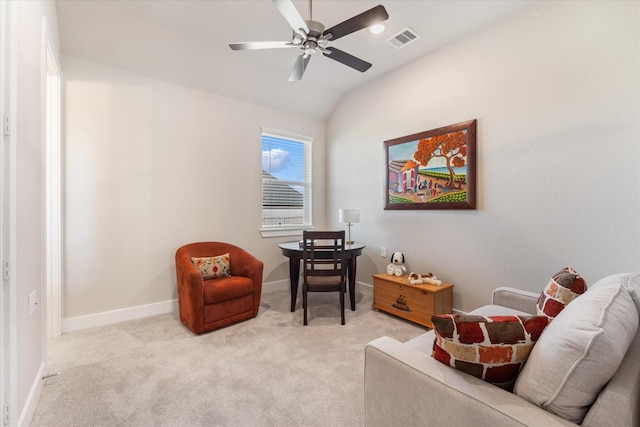 sitting room with lofted ceiling, light carpet, and ceiling fan