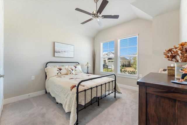 carpeted bedroom featuring vaulted ceiling and ceiling fan