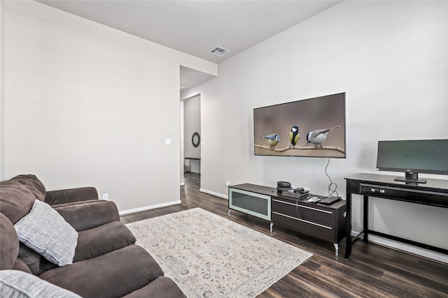 living room with dark hardwood / wood-style flooring