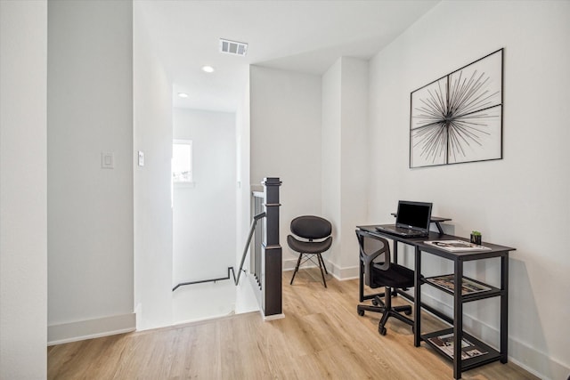 office space with light hardwood / wood-style flooring