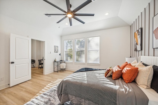 bedroom featuring lofted ceiling, light hardwood / wood-style floors, and ceiling fan