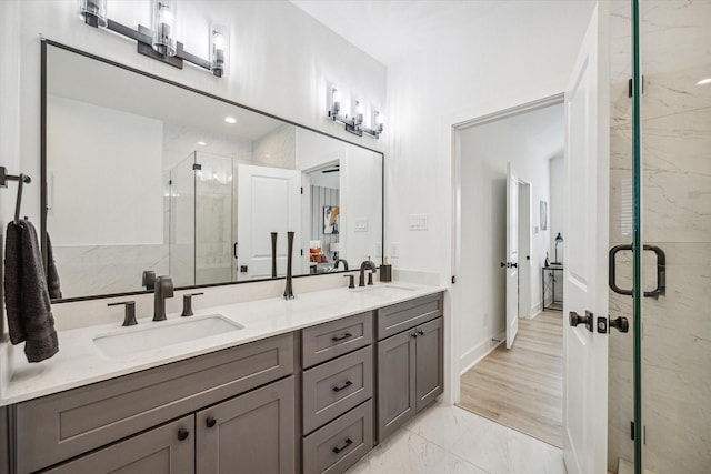 bathroom with vanity and an enclosed shower