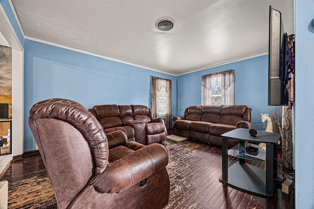 living room featuring dark wood-type flooring and ornamental molding