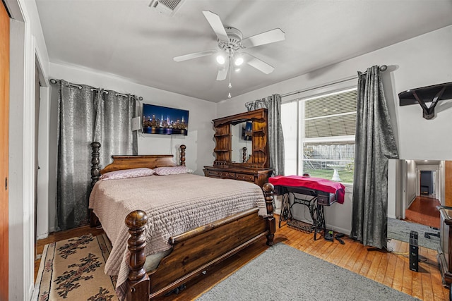 bedroom with hardwood / wood-style floors and ceiling fan