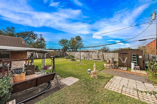 view of yard with a shed and a patio