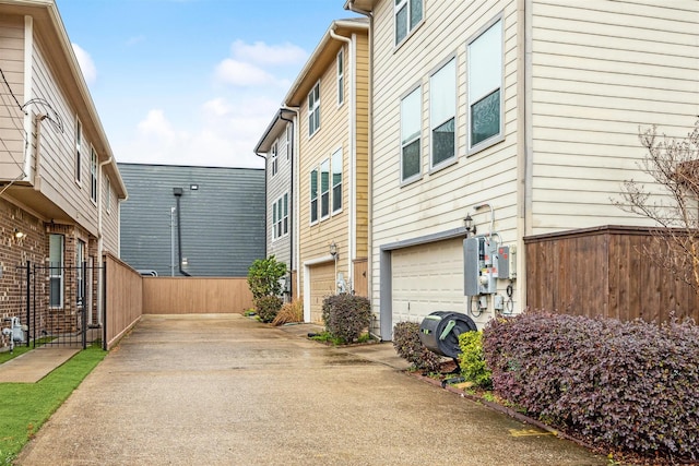 view of side of home with a garage