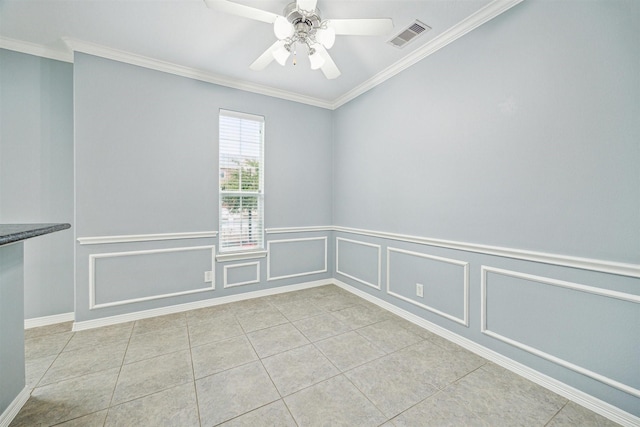 unfurnished room with crown molding, ceiling fan, and light tile patterned flooring