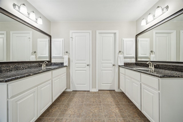 bathroom with vanity and tile patterned floors