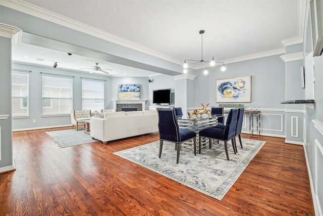 dining area featuring an inviting chandelier, hardwood / wood-style floors, and ornamental molding