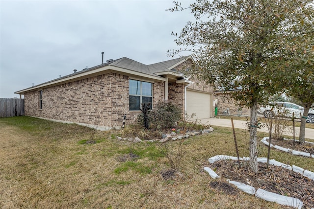 view of front of house featuring a garage and a front lawn