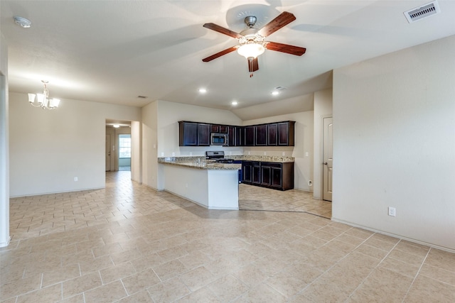 kitchen with light stone counters, vaulted ceiling, dark brown cabinets, kitchen peninsula, and ceiling fan with notable chandelier