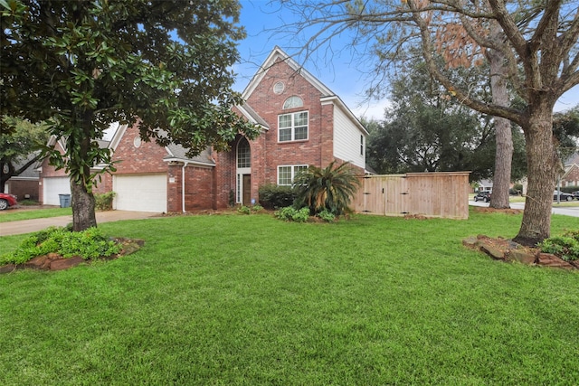 front of property featuring a garage and a front lawn