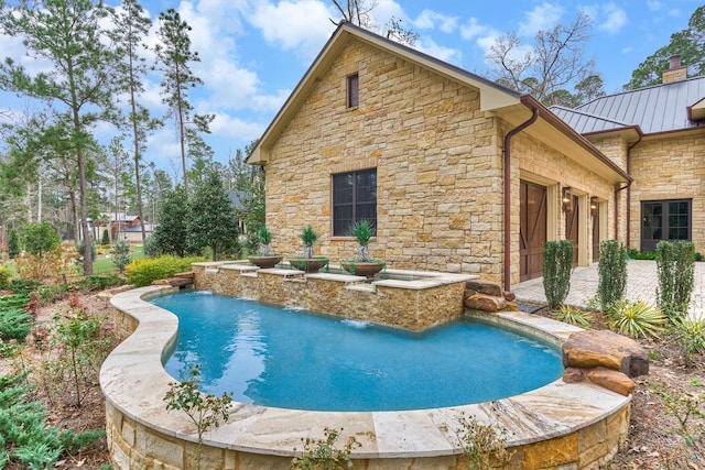 view of swimming pool featuring pool water feature