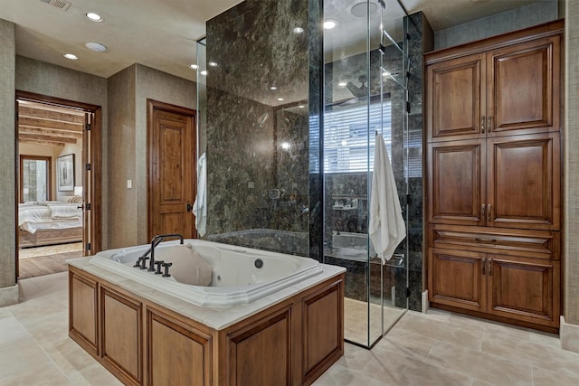 bathroom with a tub and a healthy amount of sunlight