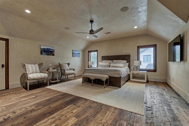 bedroom with hardwood / wood-style floors, vaulted ceiling, and ceiling fan