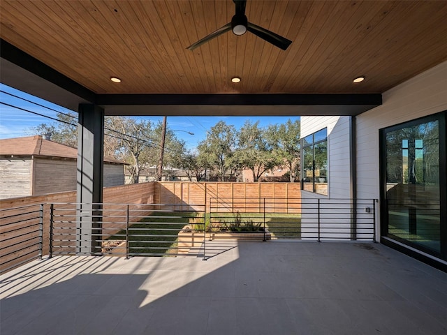 view of patio with a balcony and ceiling fan