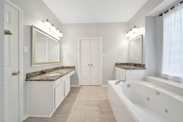 bathroom featuring vanity and a bathtub