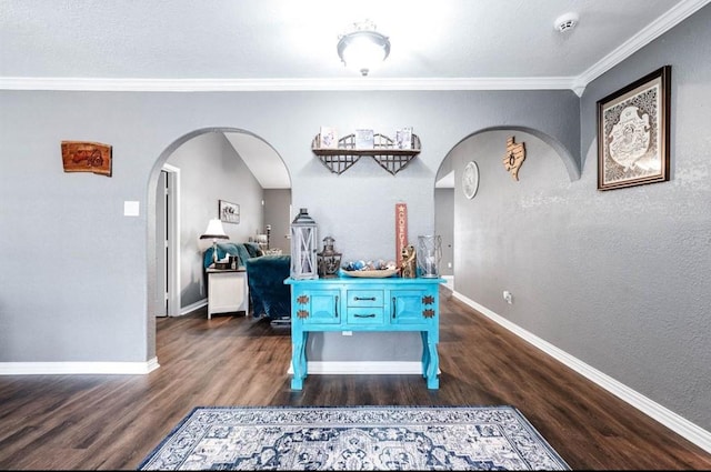 game room featuring dark wood-type flooring and ornamental molding