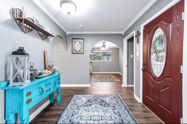 entrance foyer featuring ornamental molding and dark wood-type flooring