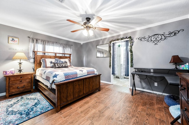 bedroom featuring hardwood / wood-style flooring, ceiling fan, and ornamental molding