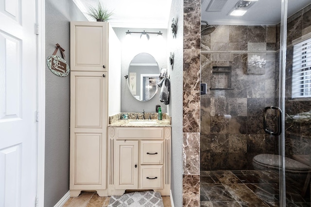 bathroom with vanity and an enclosed shower