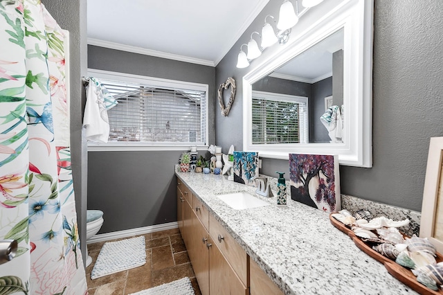 bathroom featuring ornamental molding, toilet, and vanity