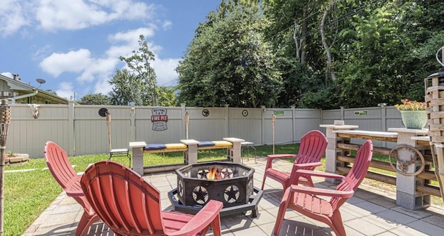 view of patio / terrace featuring a fire pit