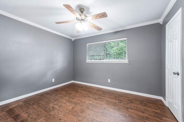 unfurnished room with crown molding, dark wood-type flooring, and ceiling fan