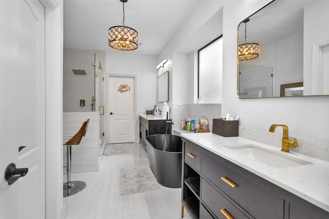 bathroom with vanity and a shower with shower door