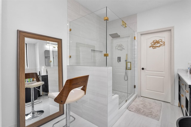 bathroom with vanity and a shower with shower door