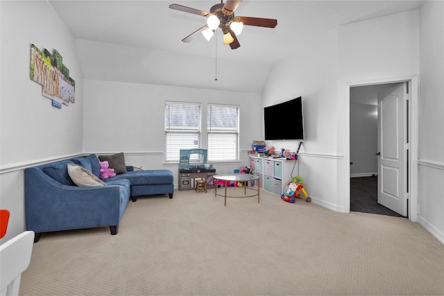 living room featuring lofted ceiling, ceiling fan, and carpet flooring