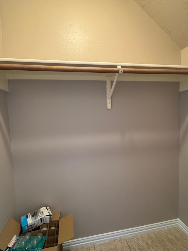 spacious closet with lofted ceiling