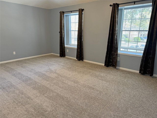 spare room with light colored carpet