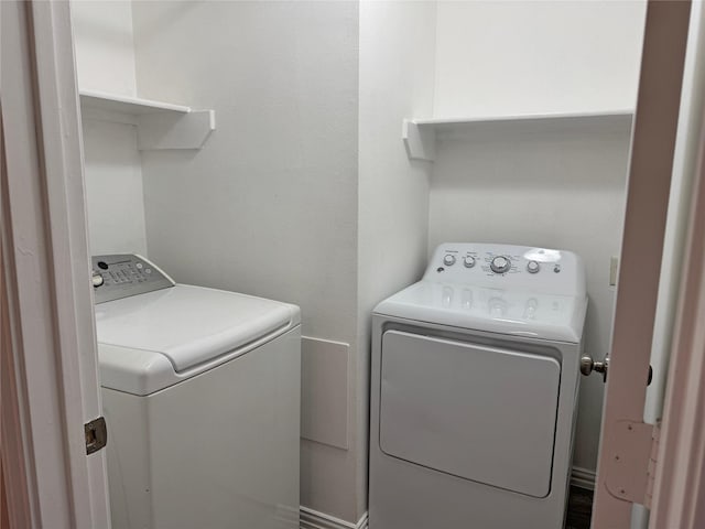 clothes washing area with washer and dryer