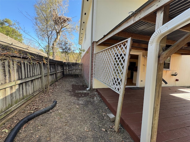 view of side of property with a wooden deck