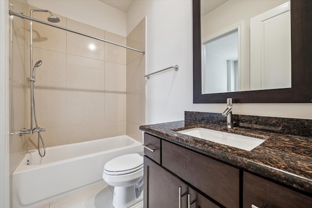 full bathroom with tiled shower / bath, vanity, and toilet