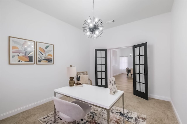 carpeted office featuring french doors and a chandelier