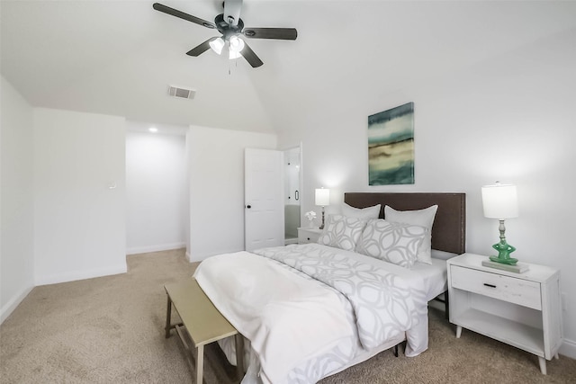 carpeted bedroom featuring lofted ceiling and ceiling fan