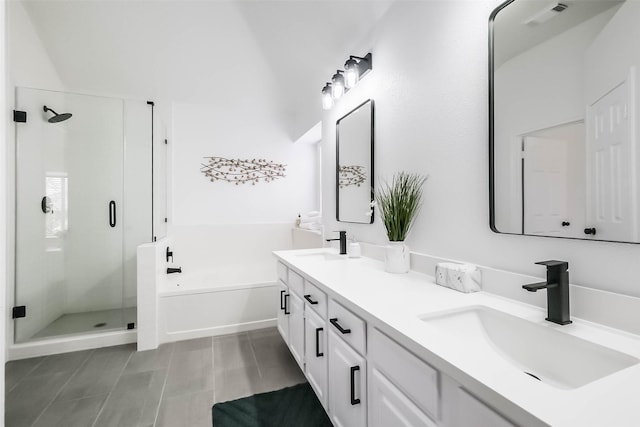 bathroom featuring vanity, independent shower and bath, and tile patterned flooring