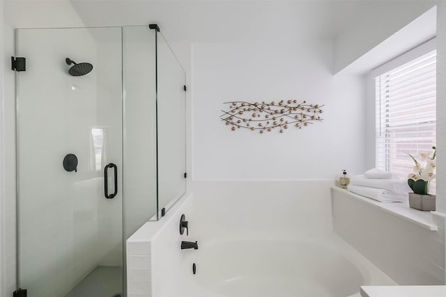 bathroom with separate shower and tub