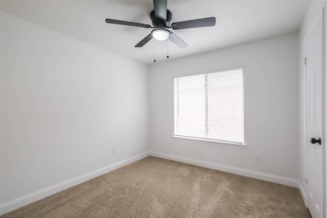 empty room featuring ceiling fan and carpet flooring