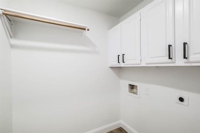 laundry room with cabinets, hardwood / wood-style flooring, electric dryer hookup, and hookup for a washing machine