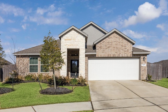 view of front of home with a front yard and a garage