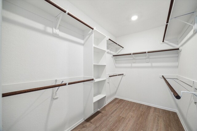 14231 Walworth Creek Ct, Rosharon, TX 77583 - walk in closet with wood finished floors